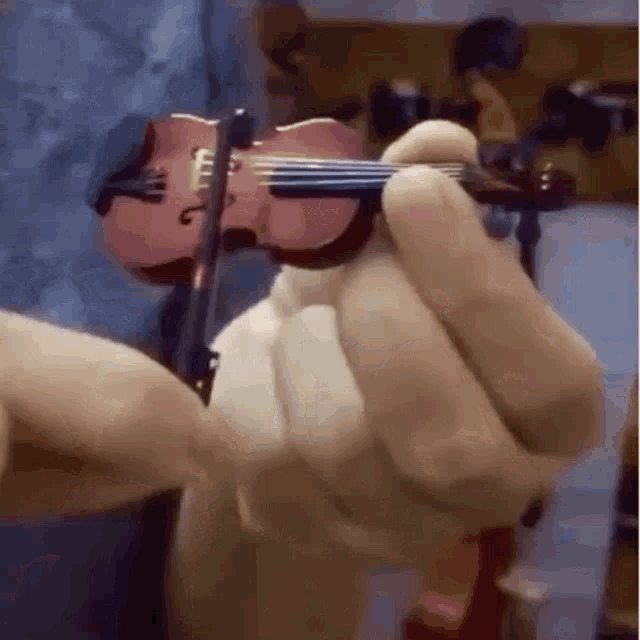 worlds-smallest-violin.gif.fd6cb306be4154bf080ffb4c6a5c6245.gif